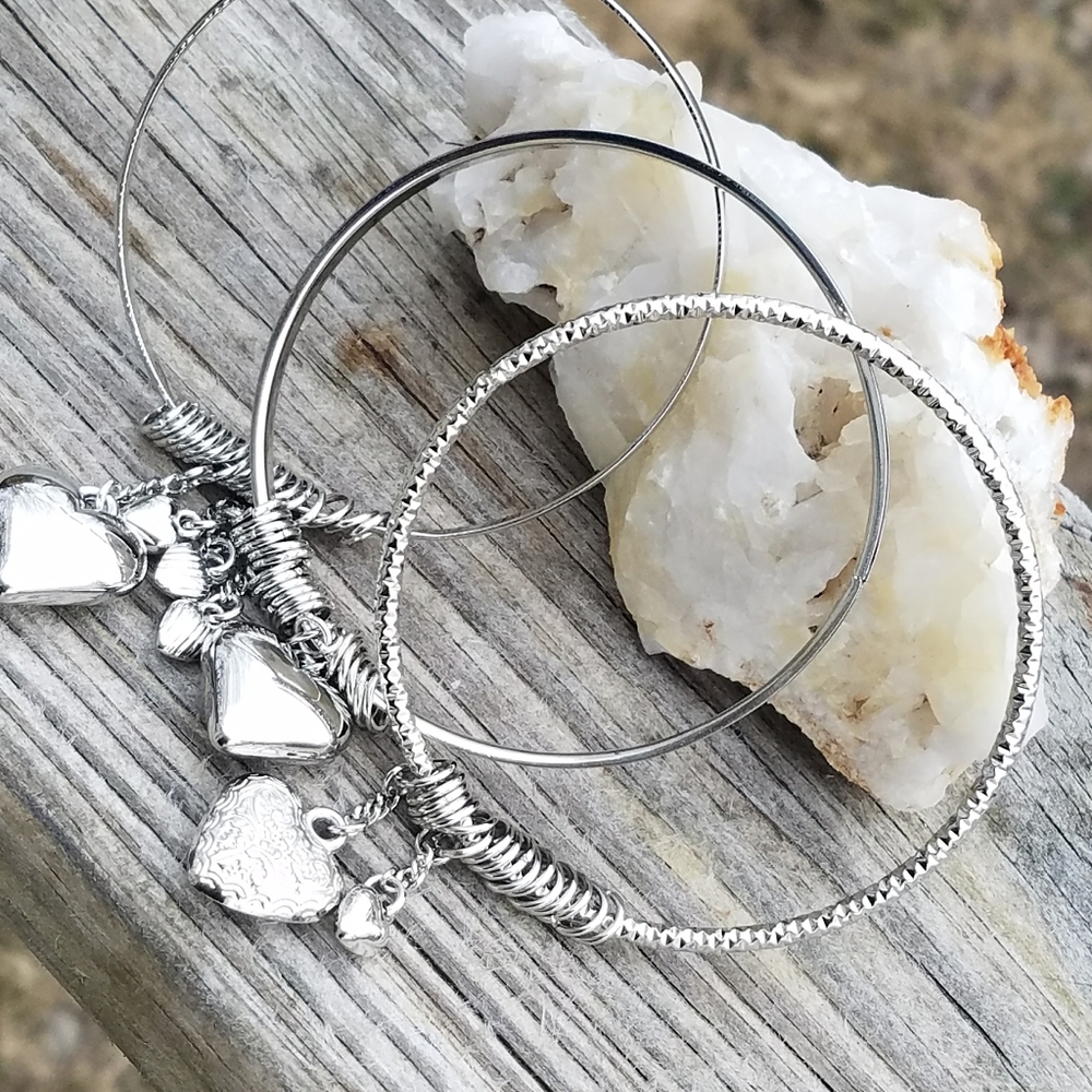 three silver heart charm bracelets